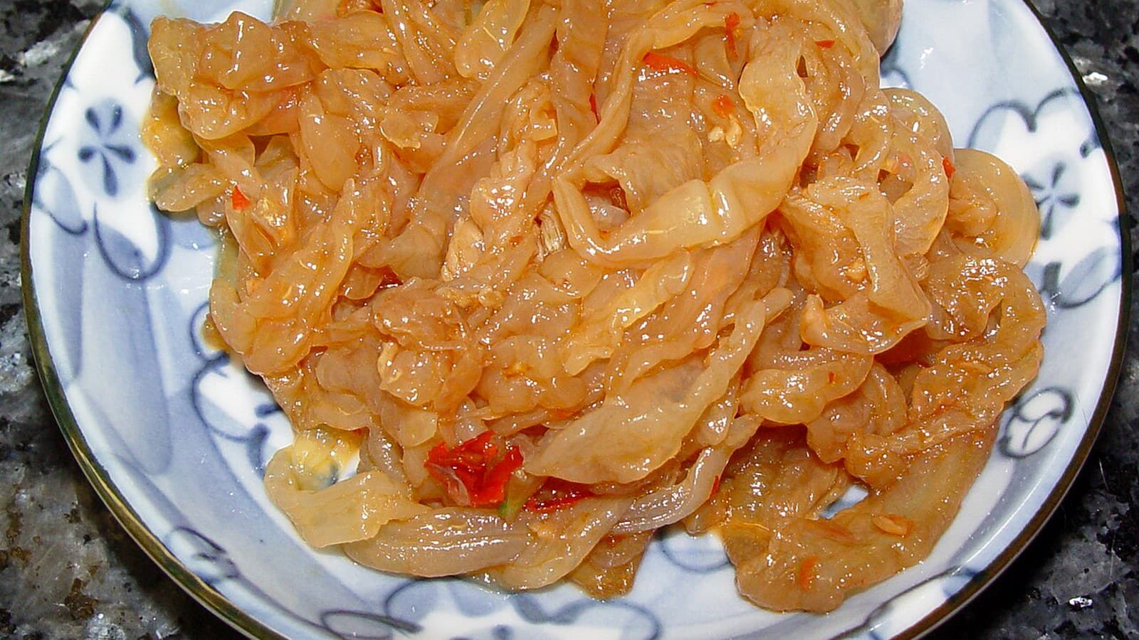 How Spicy Is Latiao? A Beginner Heat Guide mid-article image showing seasoning oil and chili coating cues