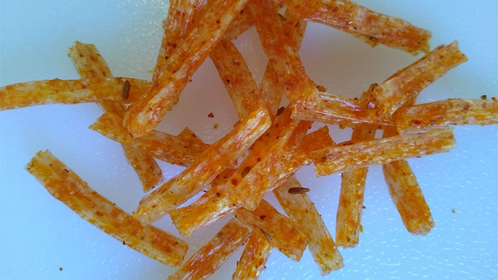 Two styles of glossy latiao strips arranged side by side for brand comparison