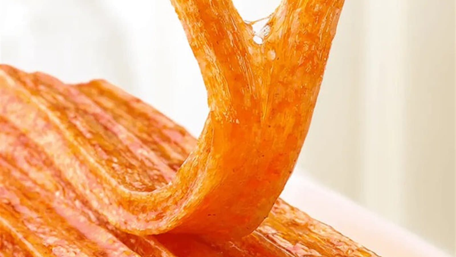 Glossy latiao strip bending upward to show chewy elasticity