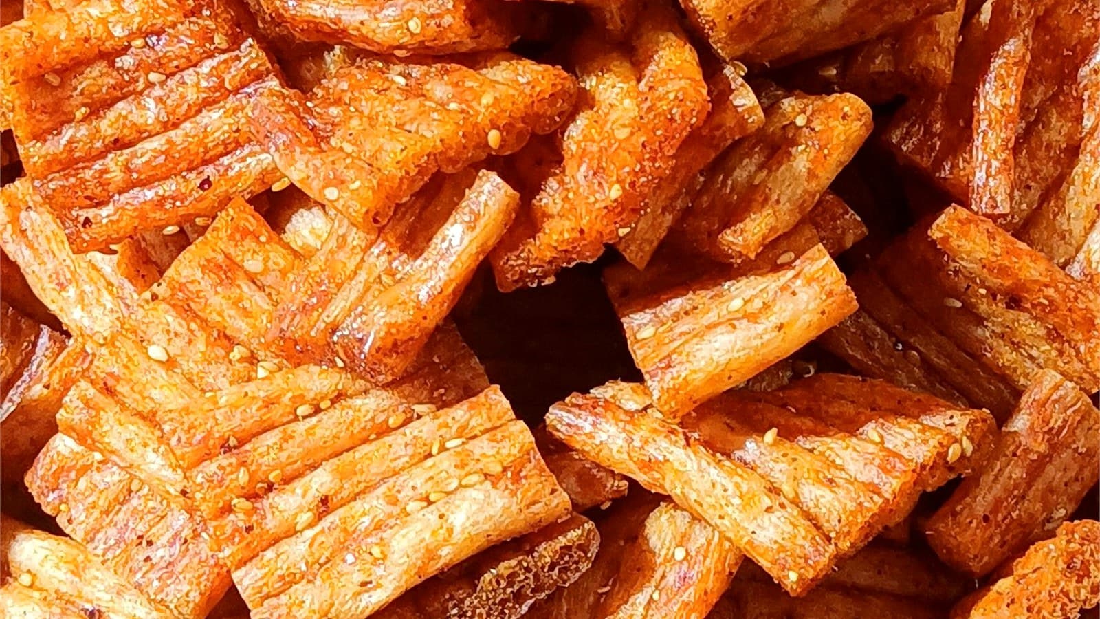 Ridged spicy strip pieces used to compare a firmer finished bite
