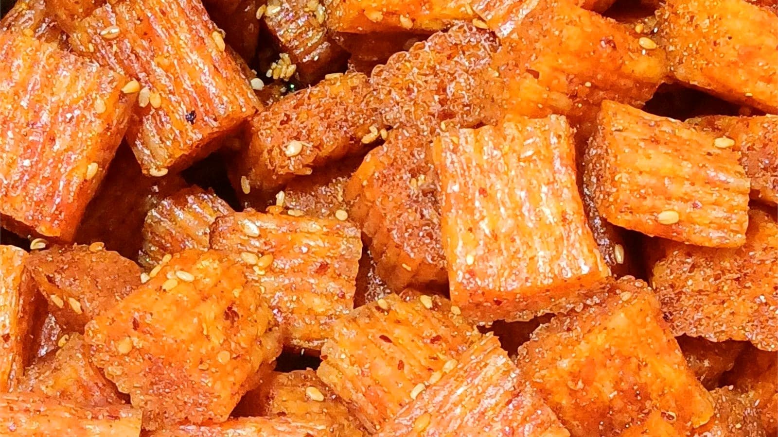 Finished spicy strip pieces used to compare seasoning coverage and gloss