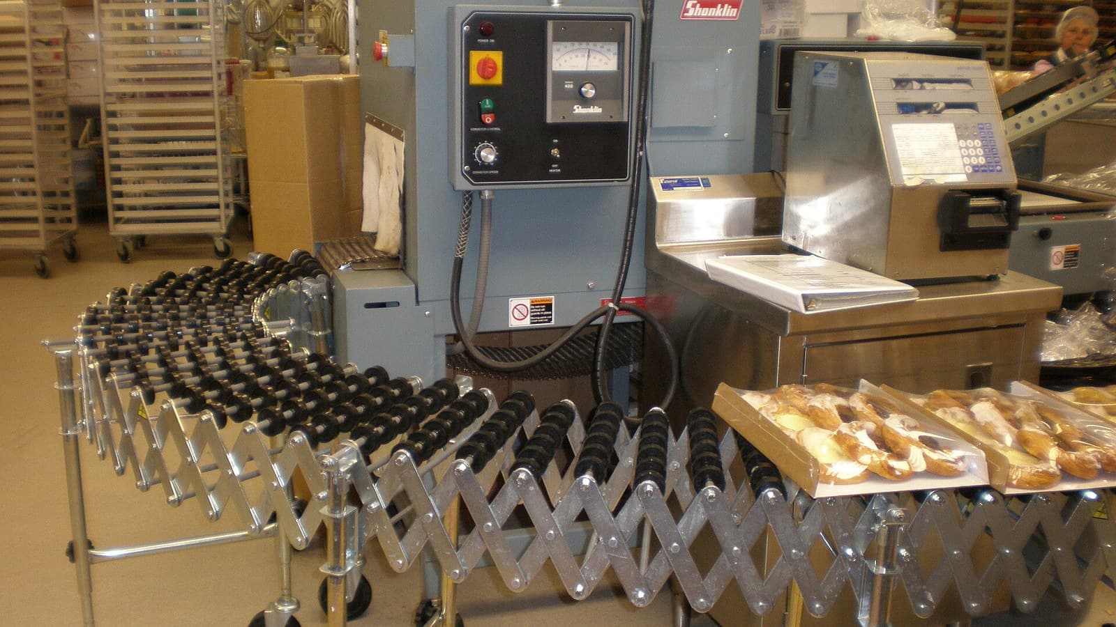 Tofu skin production trays and equipment inside a food processing workspace