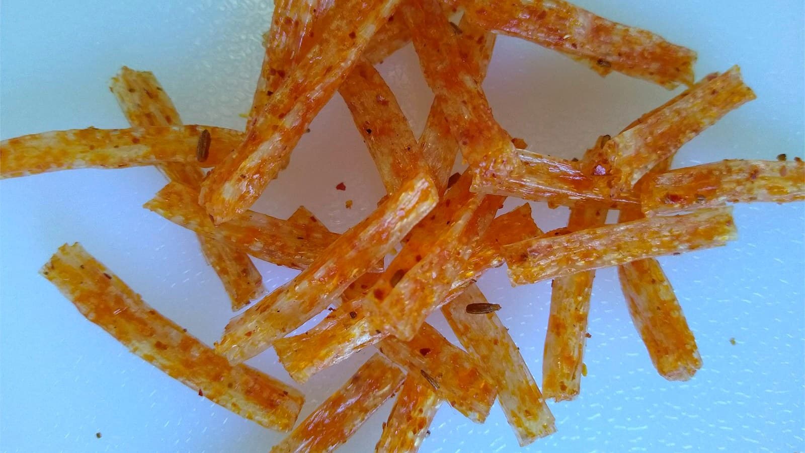 Two styles of glossy latiao strips arranged side by side for brand comparison