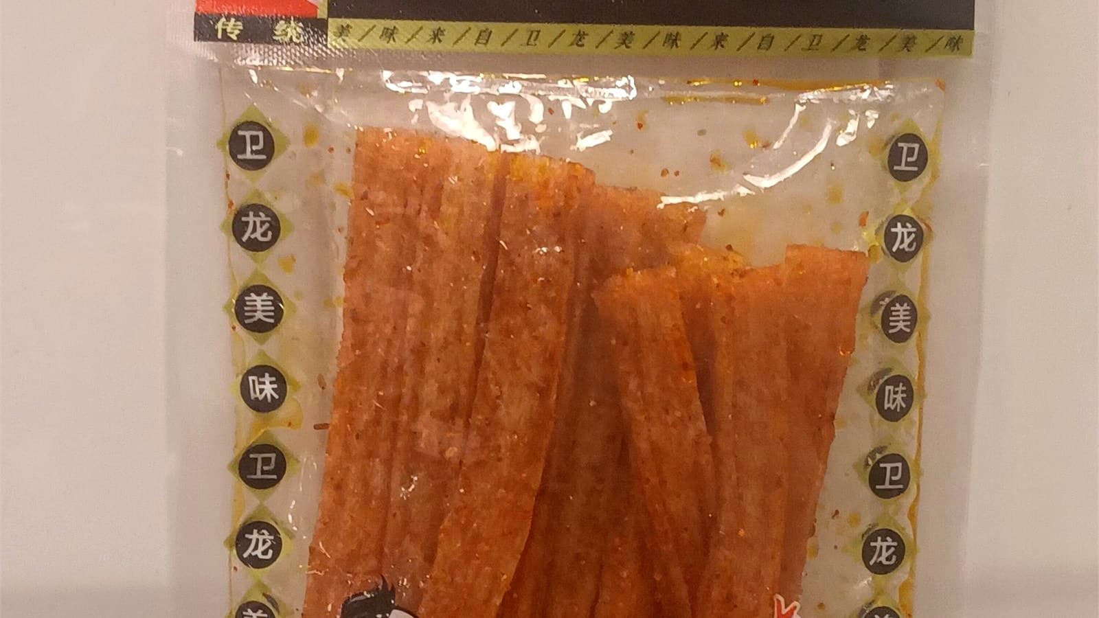 如何通过配料表判断辣条产品定位 正文中段配图：Weilong package front used to compare ingredient-position and product-type cues