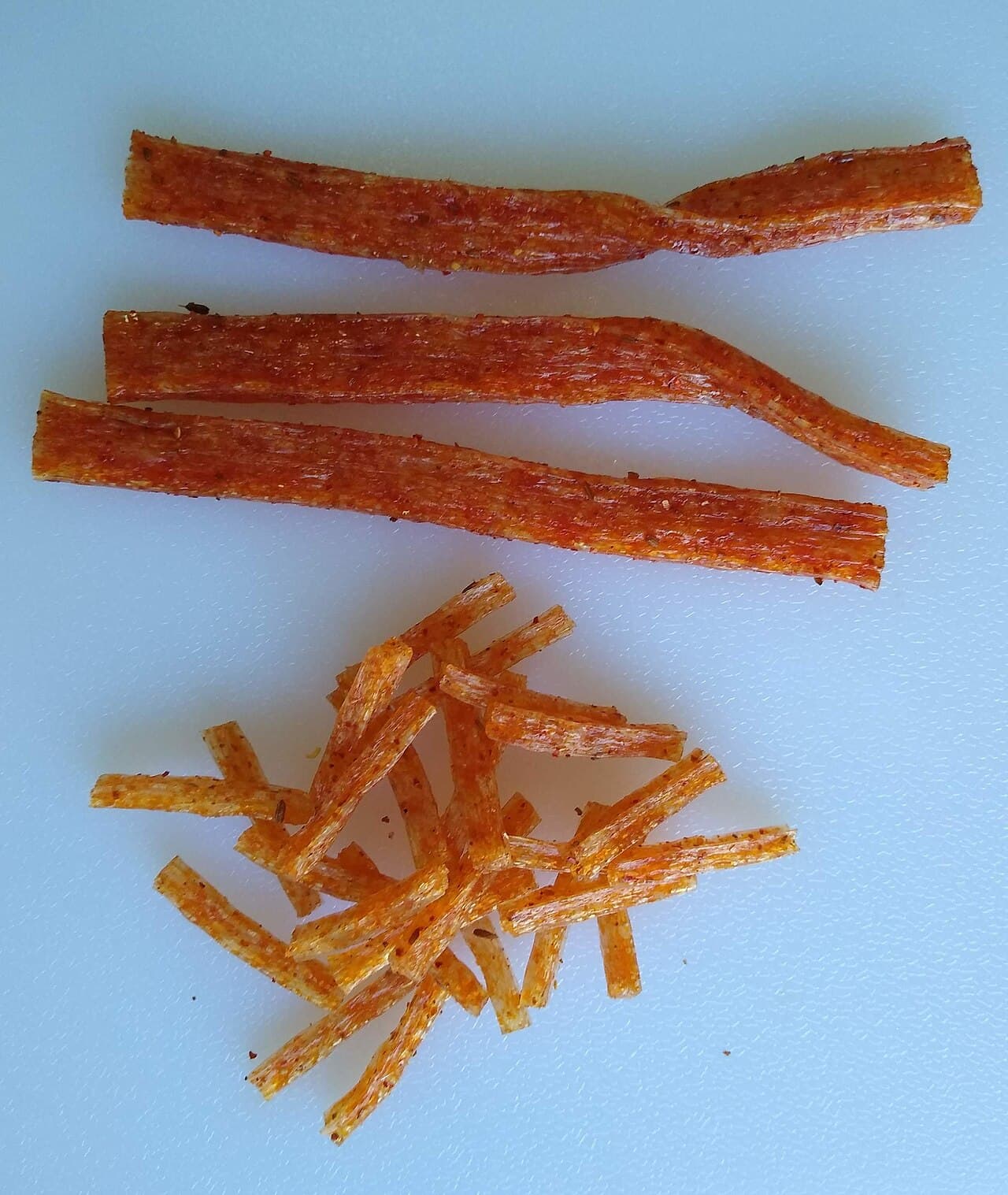 Close-up real latiao strips showing the snack texture and chili coating